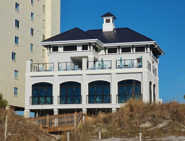 6015 Catalina Dr Unit 732, North Myrtle Beach, SC 29582 - rear view of property with a balcony, a standing seam roof, and a metal roof