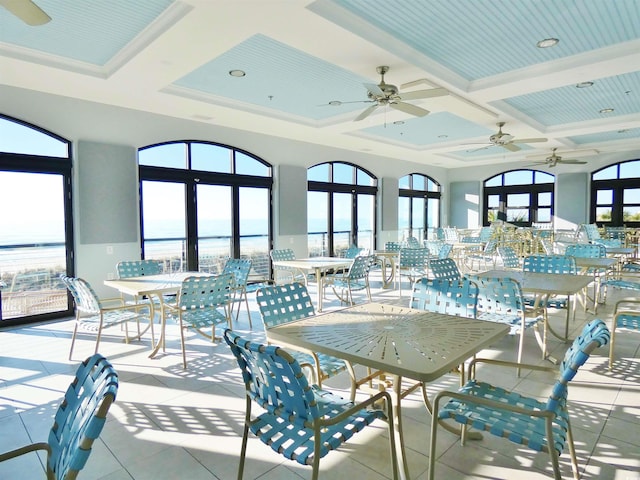 6015 Catalina Dr Unit 732, North Myrtle Beach, SC 29582 - tiled dining area featuring coffered ceiling, ceiling fan, beamed ceiling, and a water view