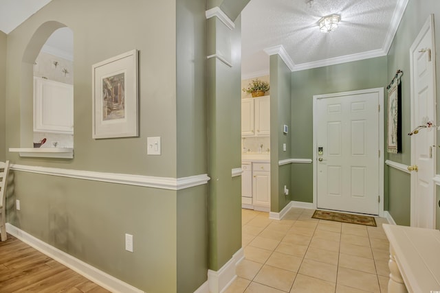 6015 Catalina Dr Unit 732, North Myrtle Beach, SC 29582 - foyer featuring arched walkways, ornamental molding, and light tile patterned floors