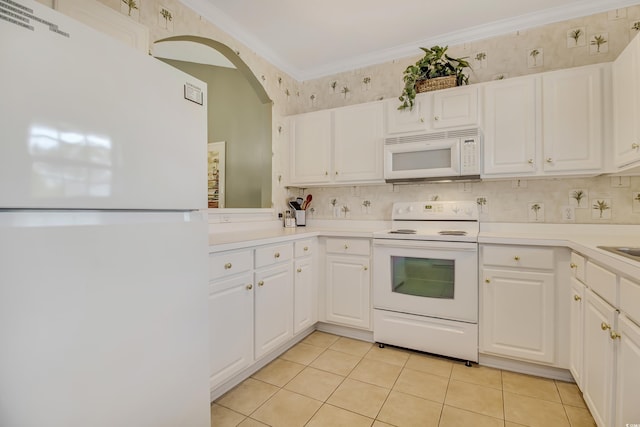 6015 Catalina Dr Unit 732, North Myrtle Beach, SC 29582 - kitchen featuring white appliances, white cabinetry, ornamental molding, light countertops, and light tile patterned floors