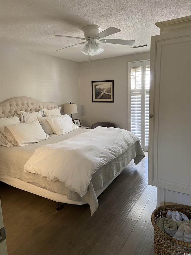 10200 Lake Shore Dr Unit 4, Myrtle Beach, SC 29572 - bedroom with a textured ceiling, wood finished floors, and ceiling fan