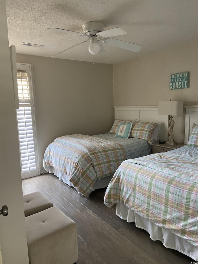 10200 Lake Shore Dr Unit 4, Myrtle Beach, SC 29572 - bedroom featuring wood finished floors, a ceiling fan, and a textured ceiling
