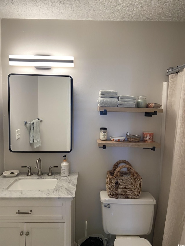 10200 Lake Shore Dr Unit 4, Myrtle Beach, SC 29572 - bathroom featuring vanity, a textured ceiling, and a shower with shower curtain