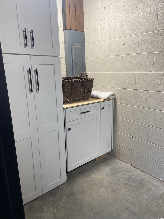 10200 Lake Shore Dr Unit 4, Myrtle Beach, SC 29572 - bathroom with concrete floors and concrete block wall