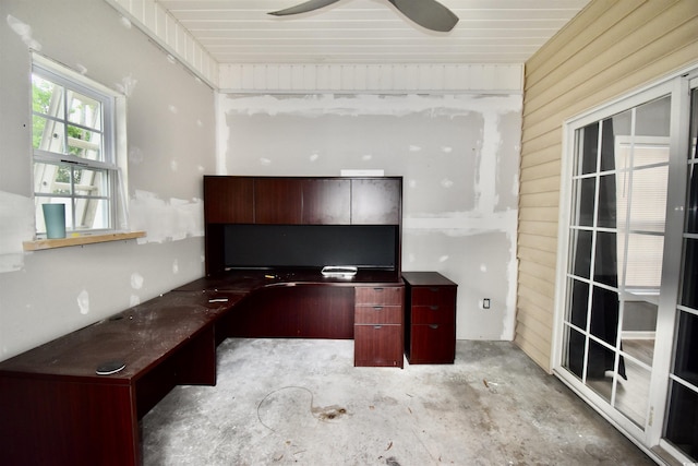 126 Clovis Cir, Myrtle Beach, SC 29579 - unfurnished office featuring wood walls, unfinished concrete floors, and a ceiling fan