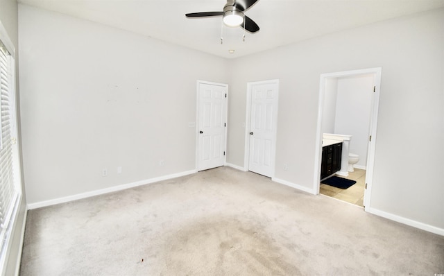 126 Clovis Cir, Myrtle Beach, SC 29579 - unfurnished bedroom with light colored carpet, baseboards, ensuite bathroom, and ceiling fan