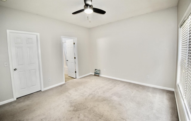 126 Clovis Cir, Myrtle Beach, SC 29579 - unfurnished bedroom featuring carpet, baseboards, ensuite bathroom, and ceiling fan