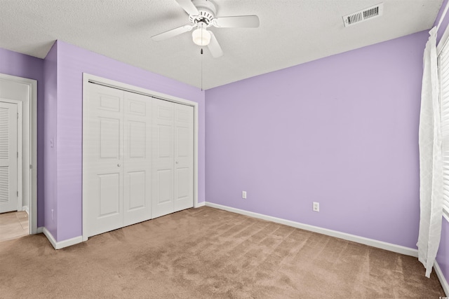 820 Fairway Dr Unit 1502Hh, Longs, SC 29568 - unfurnished bedroom featuring carpet, a closet, a ceiling fan, and a textured ceiling