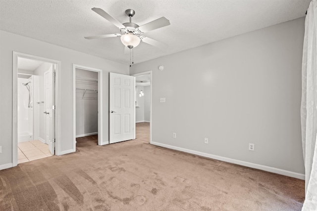 820 Fairway Dr Unit 1502Hh, Longs, SC 29568 - unfurnished bedroom featuring carpet, ensuite bath, a walk in closet, ceiling fan, and a closet