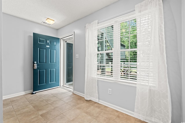 820 Fairway Dr Unit 1502Hh, Longs, SC 29568 - tiled entryway with baseboards and a textured ceiling
