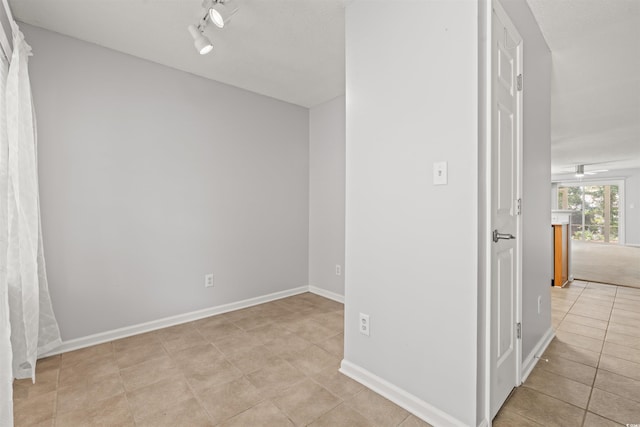 820 Fairway Dr Unit 1502Hh, Longs, SC 29568 - empty room featuring light tile patterned floors, rail lighting, and ceiling fan