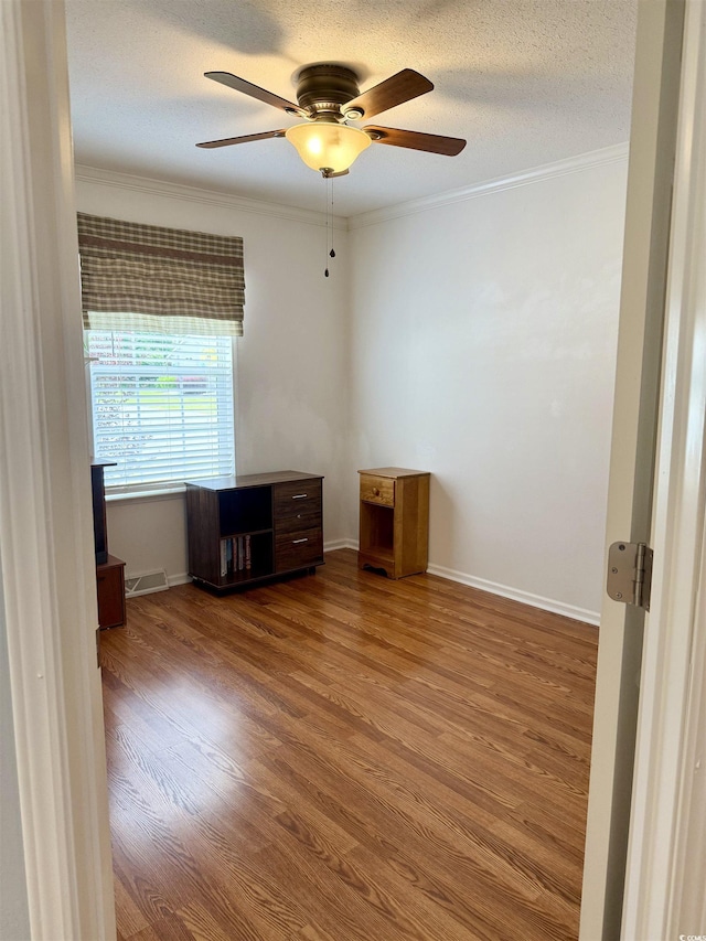 216 Walden Lake Rd, Conway, SC 29526 - spare room featuring ceiling fan, ornamental molding, and wood finished floors