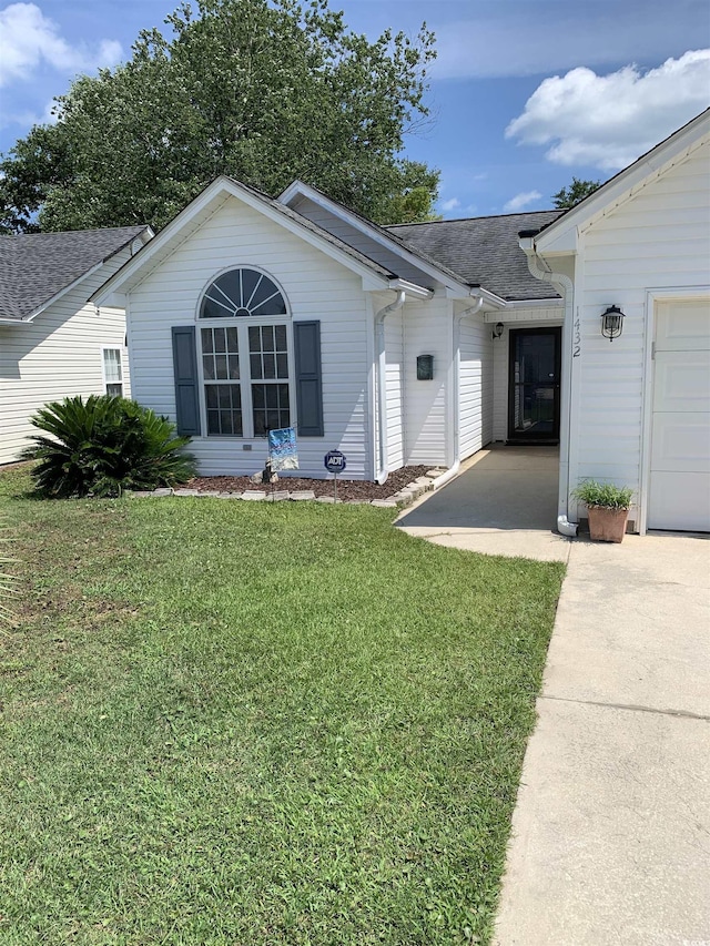 1432 Seahouse Ct, Surfside Beach, SC 29575 - ranch-style home with roof with shingles and a front lawn
