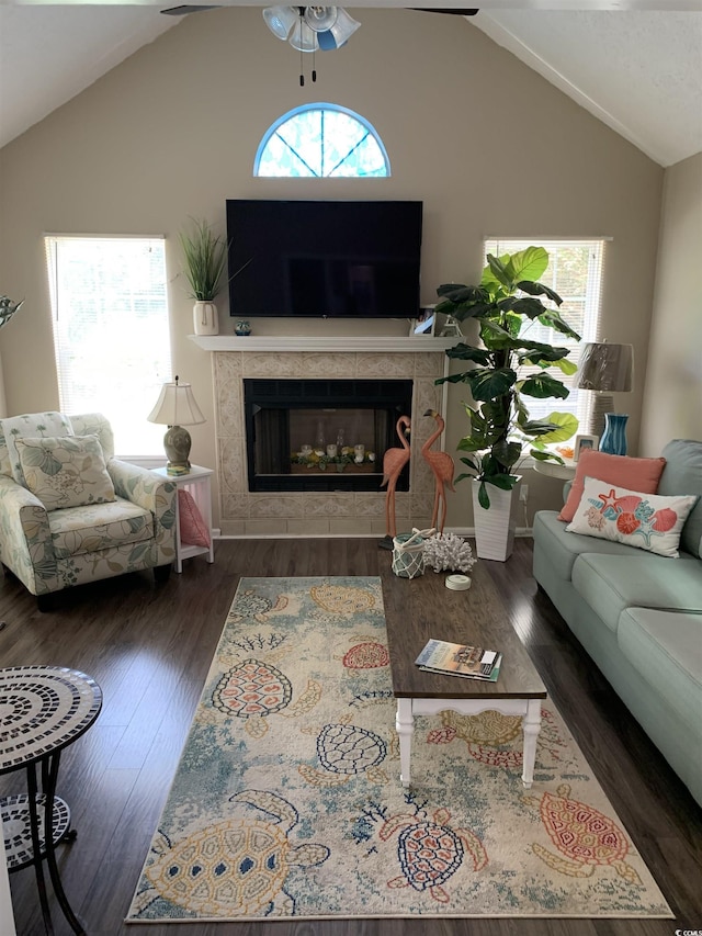 1432 Seahouse Ct, Surfside Beach, SC 29575 - living area featuring a ceiling fan, vaulted ceiling, plenty of natural light, and a tile fireplace