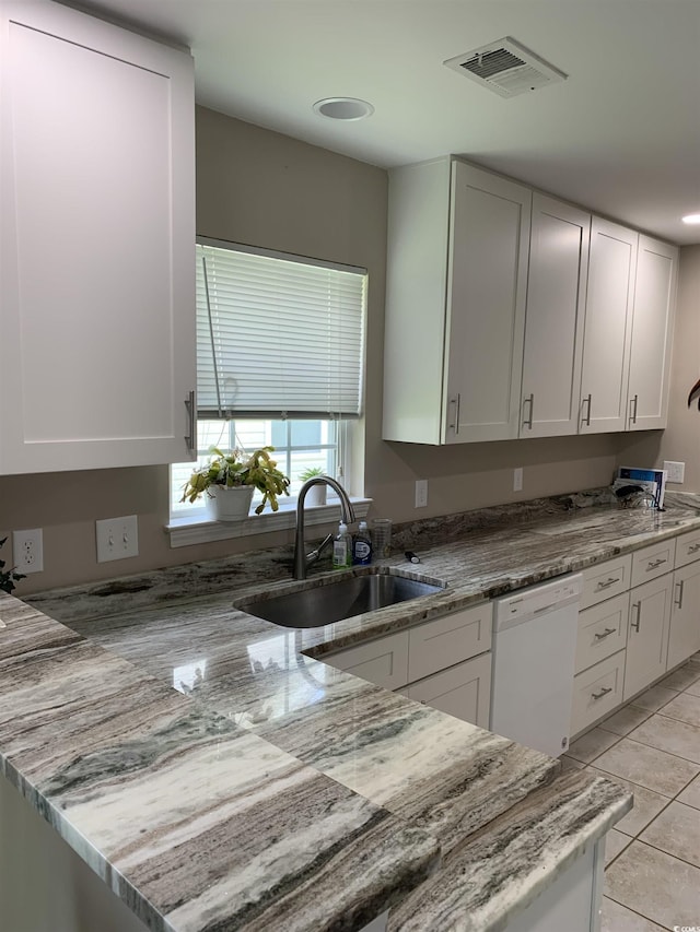 1432 Seahouse Ct, Surfside Beach, SC 29575 - kitchen with dishwasher, light stone countertops, white cabinets, and recessed lighting