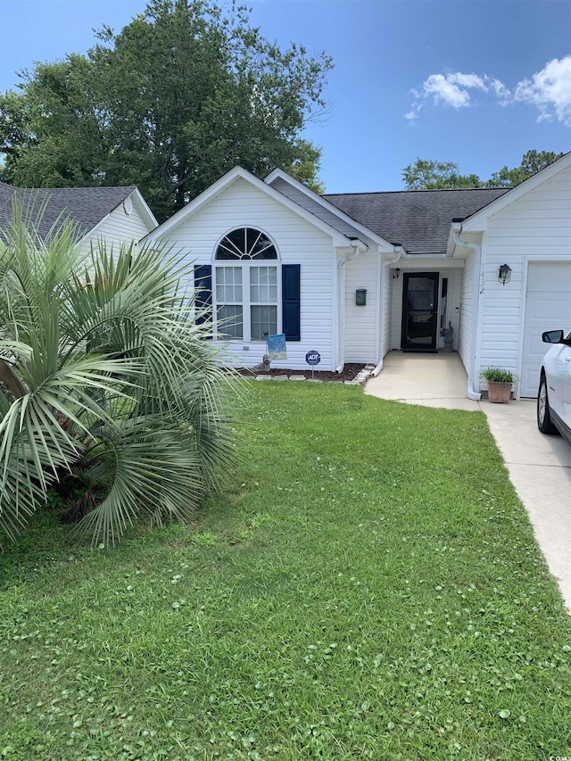 1432 Seahouse Ct, Surfside Beach, SC 29575 - view of front of home with a front lawn, a shingled roof, and an attached garage