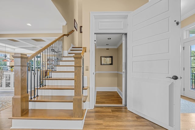 191 Grackle Ln, Pawleys Island, SC 29585 - stairway featuring ornamental molding, wood finished floors, coffered ceiling, baseboards, and beamed ceiling