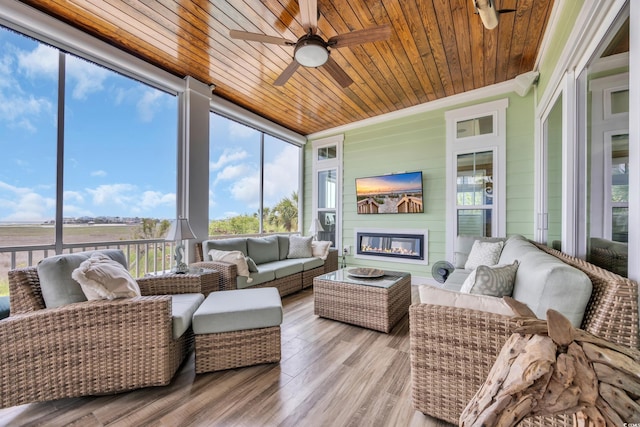191 Grackle Ln, Pawleys Island, SC 29585 - sunroom / solarium featuring an outdoor living space with a fireplace, plenty of natural light, and ceiling fan