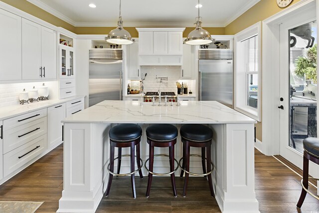 191 Grackle Ln, Pawleys Island, SC 29585 - kitchen featuring built in refrigerator, ornamental molding, decorative backsplash, dark wood finished floors, and recessed lighting