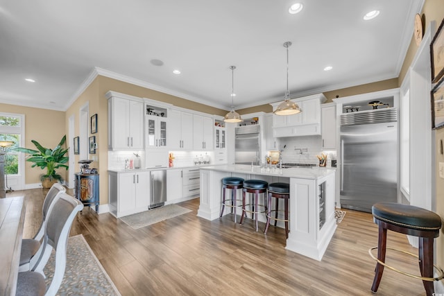 191 Grackle Ln, Pawleys Island, SC 29585 - kitchen featuring stainless steel built in refrigerator, light countertops, refrigerator, backsplash, and recessed lighting