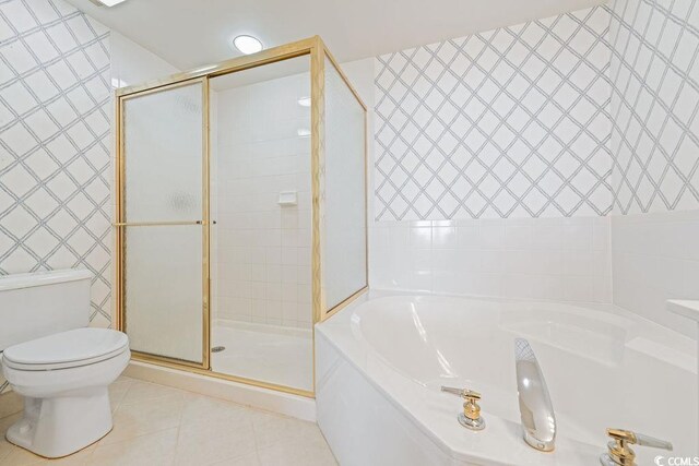341 S Dunes Dr Unit C-34, Pawleys Island, SC 29585 - bathroom with a bath, a stall shower, toilet, and tile patterned flooring