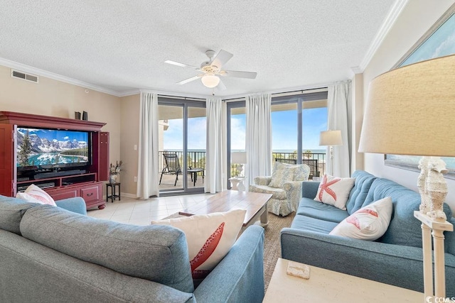341 S Dunes Dr Unit C-34, Pawleys Island, SC 29585 - tiled living area with ceiling fan, crown molding, plenty of natural light, and a textured ceiling