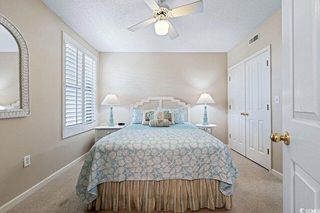 341 S Dunes Dr Unit C-34, Pawleys Island, SC 29585 - bedroom featuring carpet flooring, baseboards, a textured ceiling, a ceiling fan, and a closet