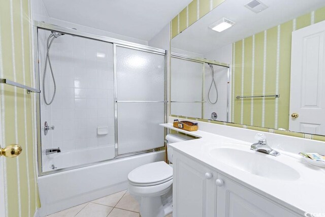 341 S Dunes Dr Unit C-34, Pawleys Island, SC 29585 - full bath with vanity, toilet, tile patterned floors, bath / shower combo with glass door, and wallpapered walls