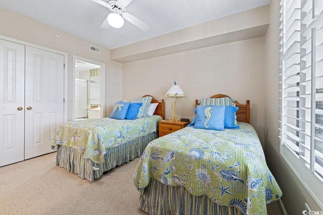 341 S Dunes Dr Unit C-34, Pawleys Island, SC 29585 - bedroom with carpet, a closet, ensuite bath, and a ceiling fan