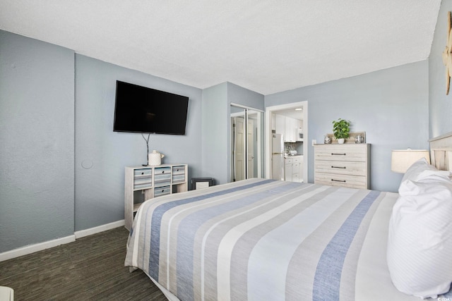 2001 S Ocean Blvd Unit 815, Myrtle Beach, SC 29577 - carpeted bedroom featuring freestanding refrigerator and ensuite bathroom
