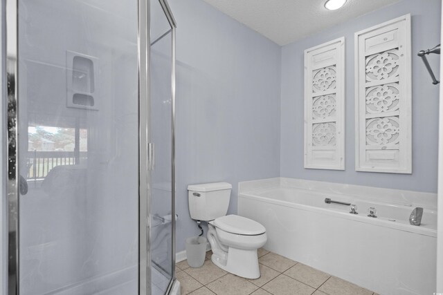 1551 Spinnaker Dr Unit 5312, North Myrtle Beach, SC 29582 - bathroom featuring a textured ceiling, tile patterned flooring, a stall shower, and a bath