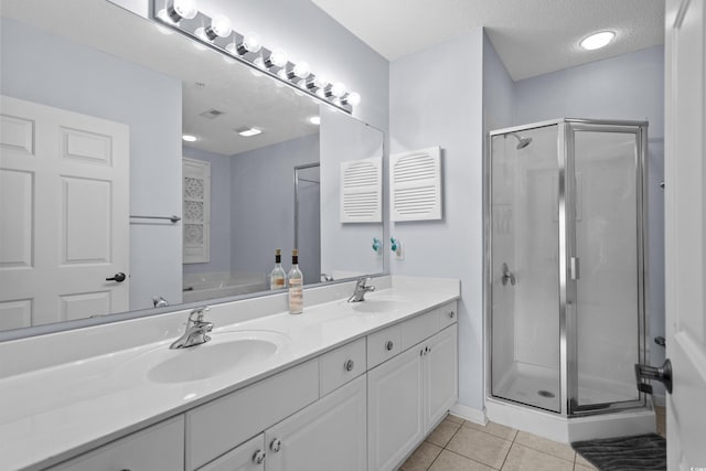 1551 Spinnaker Dr Unit 5312, North Myrtle Beach, SC 29582 - full bath with a shower stall, double vanity, tile patterned flooring, and a textured ceiling