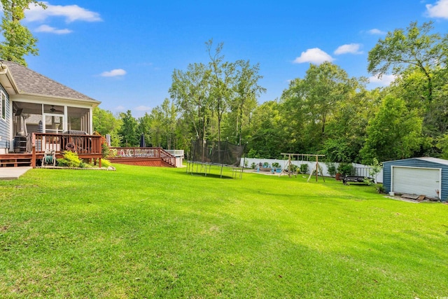 1051 Academy Dr, Conway, SC 29526 - view of yard with a trampoline, a sunroom, a deck, and a playground