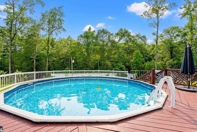 1051 Academy Dr, Conway, SC 29526 - view of swimming pool with a deck and a forest view