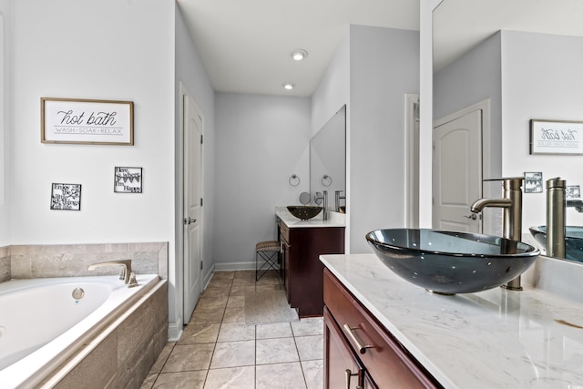1051 Academy Dr, Conway, SC 29526 - full bath with two vanities, a garden tub, recessed lighting, and baseboards