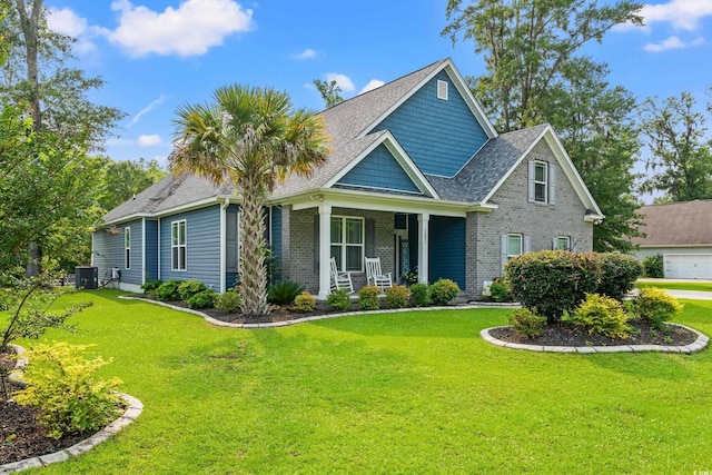 1051 Academy Dr, Conway, SC 29526 - craftsman house featuring a porch, a front lawn, and brick siding