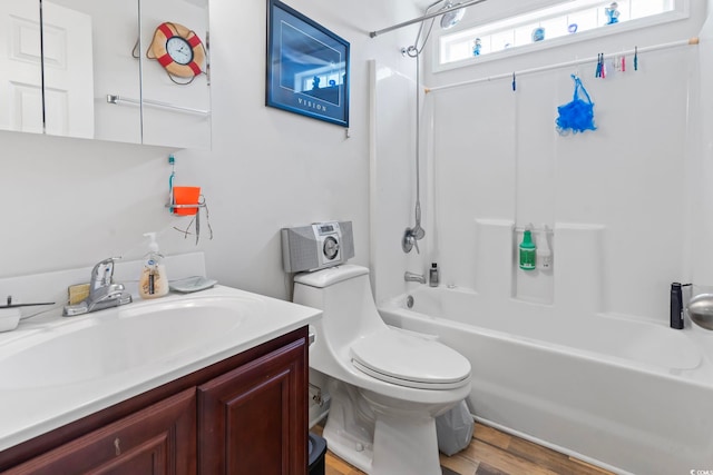 1068 Lizzie Ln, Surfside Beach, SC 29575 - bathroom featuring  shower combination, toilet, vanity, and wood finished floors