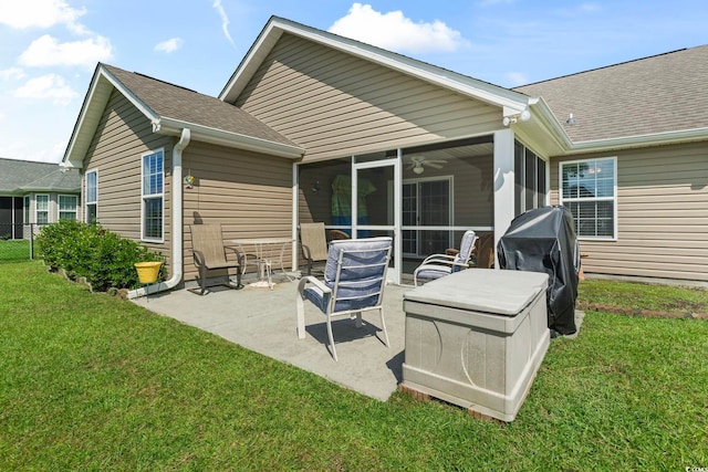 1068 Lizzie Ln, Surfside Beach, SC 29575 - back of property with a sunroom, a patio area, a lawn, roof with shingles, and a ceiling fan