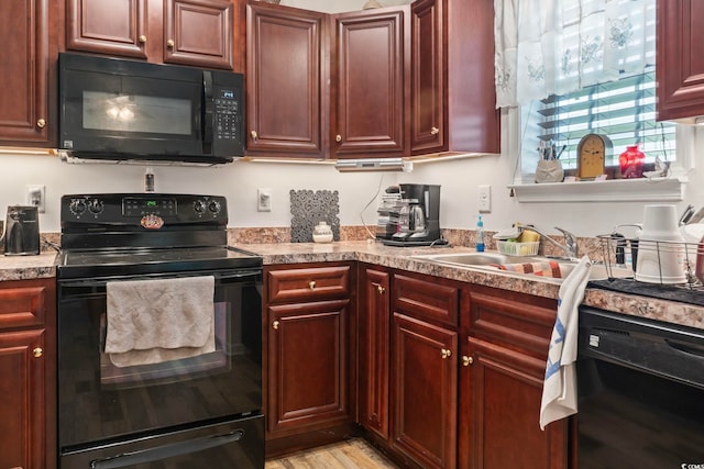 1068 Lizzie Ln, Surfside Beach, SC 29575 - kitchen featuring black appliances, dark brown cabinets, light countertops, and a sink