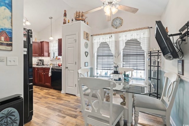 1068 Lizzie Ln, Surfside Beach, SC 29575 - dining room with lofted ceiling, light wood-type flooring, and ceiling fan