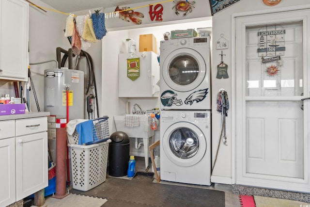1068 Lizzie Ln, Surfside Beach, SC 29575 - washroom featuring stacked washer / dryer, cabinet space, and water heater