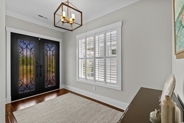 433 Saint Julian Ln, Myrtle Beach, SC 29579 - entrance foyer featuring french doors, a chandelier, ornamental molding, wood finished floors, and baseboards