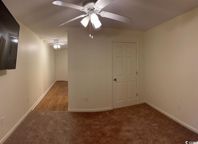 610 Putters Ln Unit H209, Little River, SC 29566 - empty room with ceiling fan, carpet flooring, and a textured ceiling