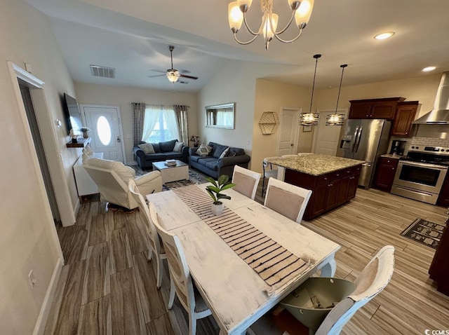 541 Irees Way, Longs, SC 29568 - dining room featuring wood finished floors, lofted ceiling, a chandelier, ceiling fan, and baseboards