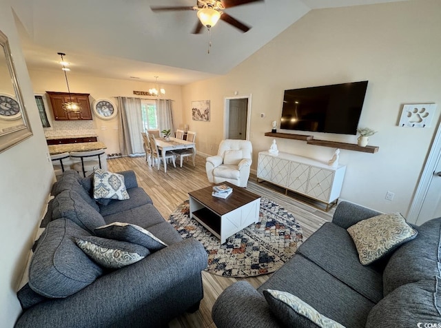 541 Irees Way, Longs, SC 29568 - living area featuring light wood finished floors, ceiling fan, a chandelier, and vaulted ceiling