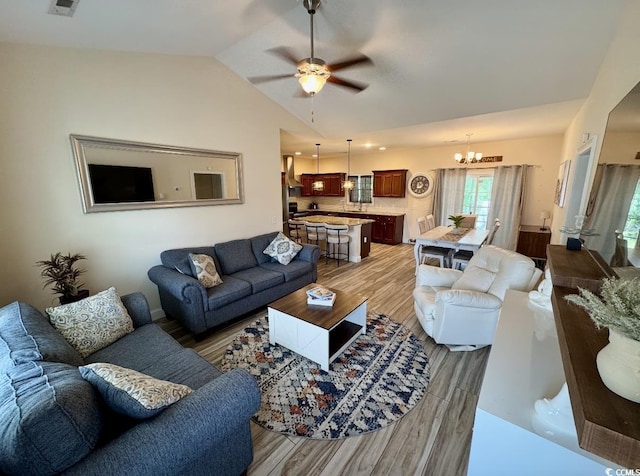 541 Irees Way, Longs, SC 29568 - living room with light wood-type flooring, a chandelier, lofted ceiling, and a ceiling fan