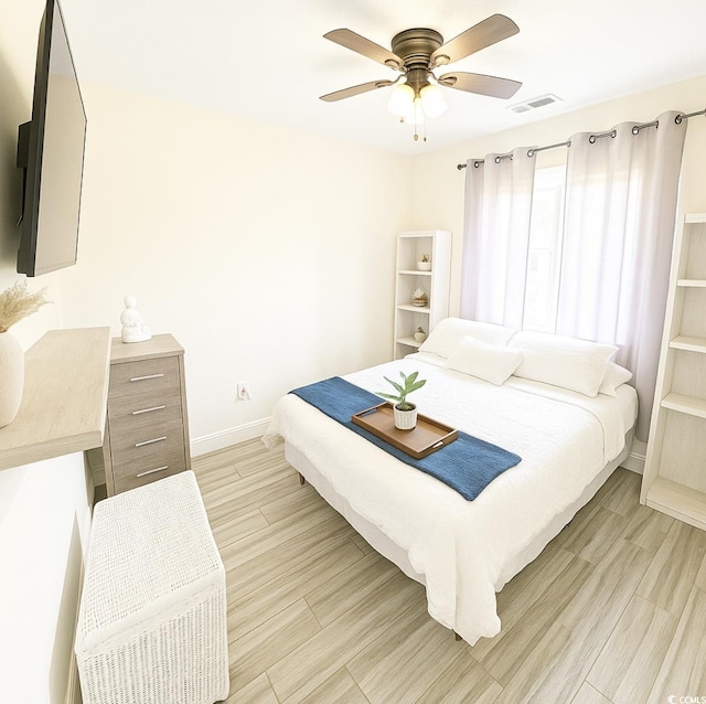 541 Irees Way, Longs, SC 29568 - bedroom with baseboards, light wood-style flooring, and a ceiling fan