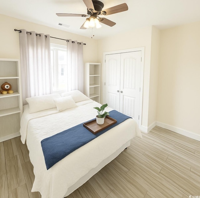 541 Irees Way, Longs, SC 29568 - bedroom with a closet, baseboards, light wood finished floors, and ceiling fan