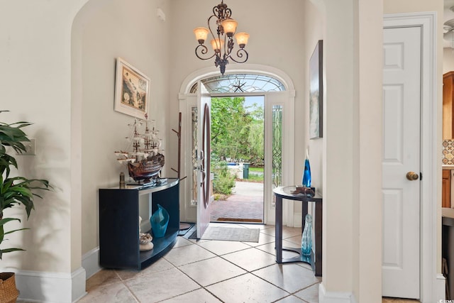 1501 Harbor Dr, North Myrtle Beach, SC 29582 - entrance foyer featuring a chandelier, light tile patterned flooring, and a towering ceiling