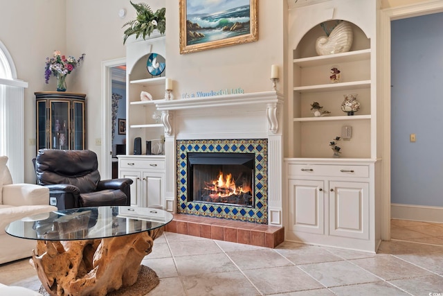 1501 Harbor Dr, North Myrtle Beach, SC 29582 - living area with built in shelves, a tile fireplace, and baseboards